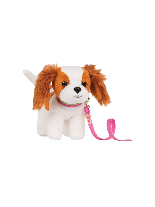 Toy puppy with a leash king charles spaniel