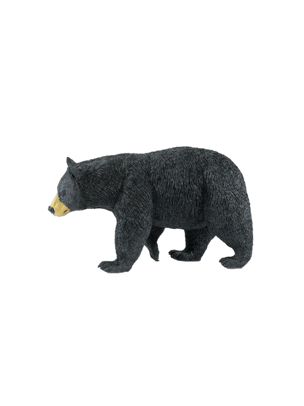 A large figurine of a black bear black bear