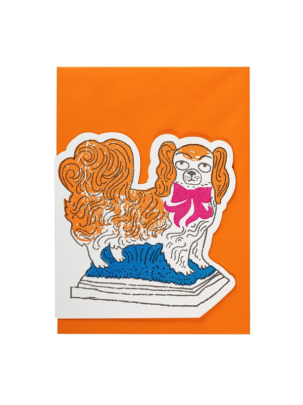 A decorative card with an envelope pekinese