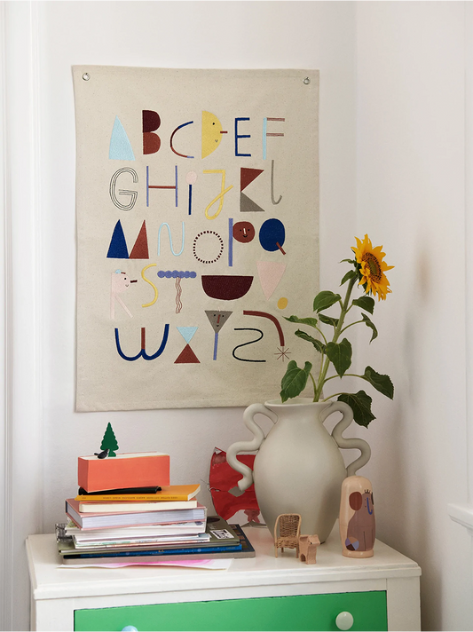 Fabric embroidered poster with the alphabet