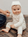 Allie pointelle baby onesie with zipper antique white