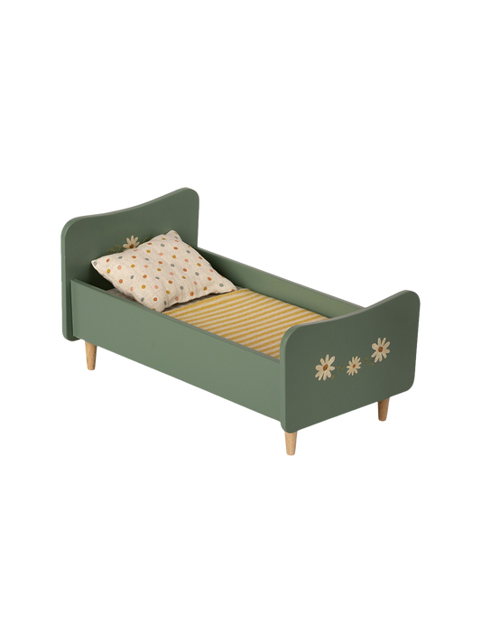 wooden mini cot with bedding