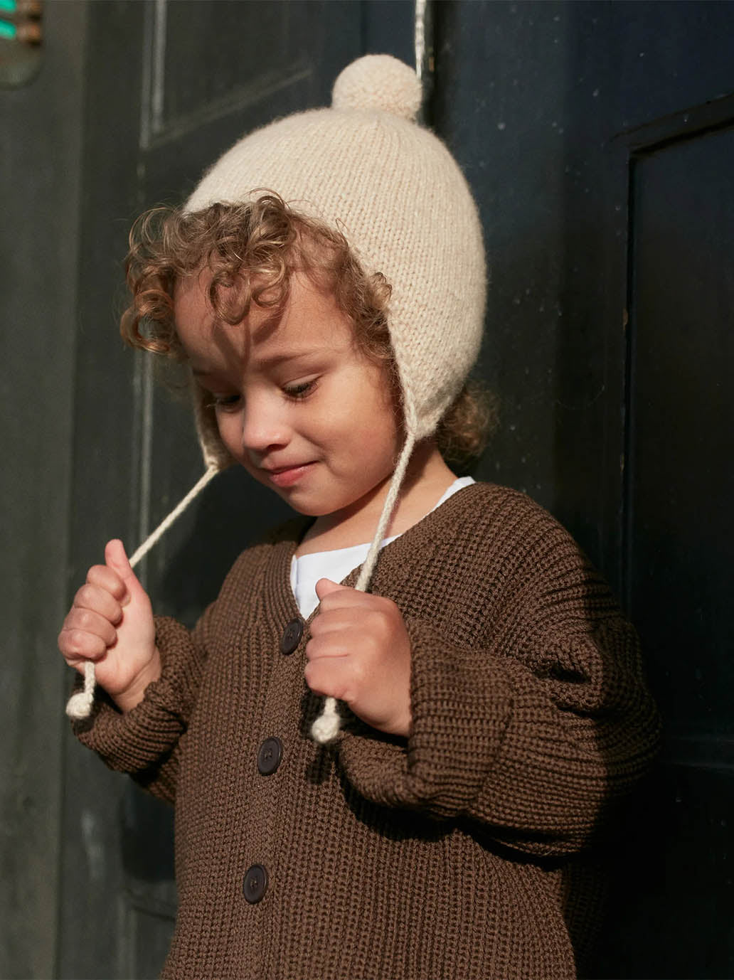 Gorro bebé de lana merino con pompón