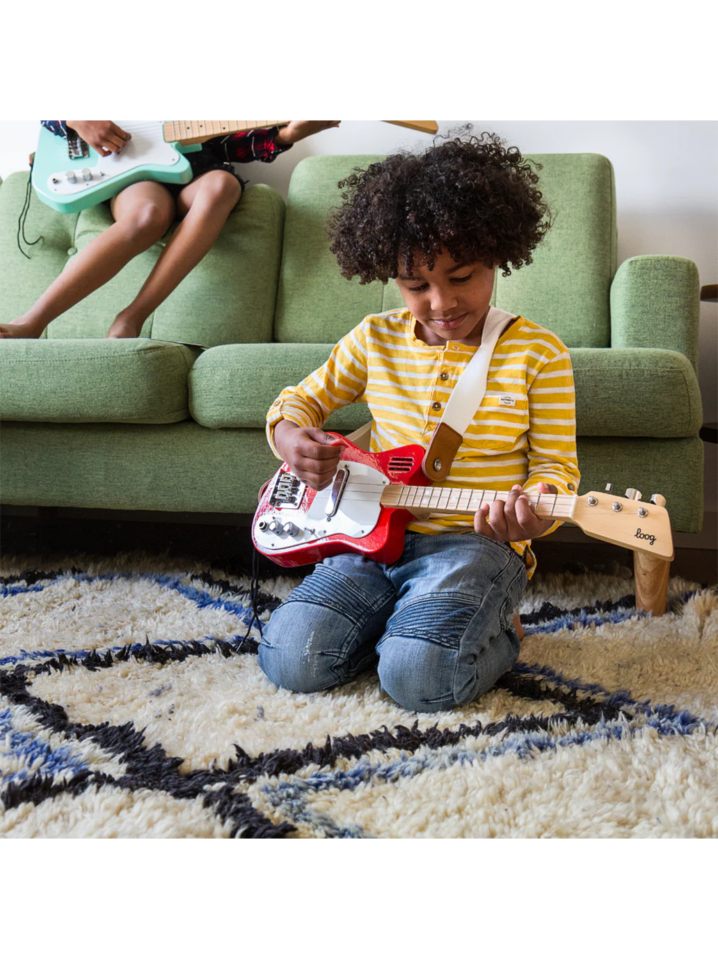 Mini guitarra eléctrica loog para niños.
