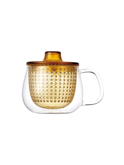 Taza de té de cristal con infusor.