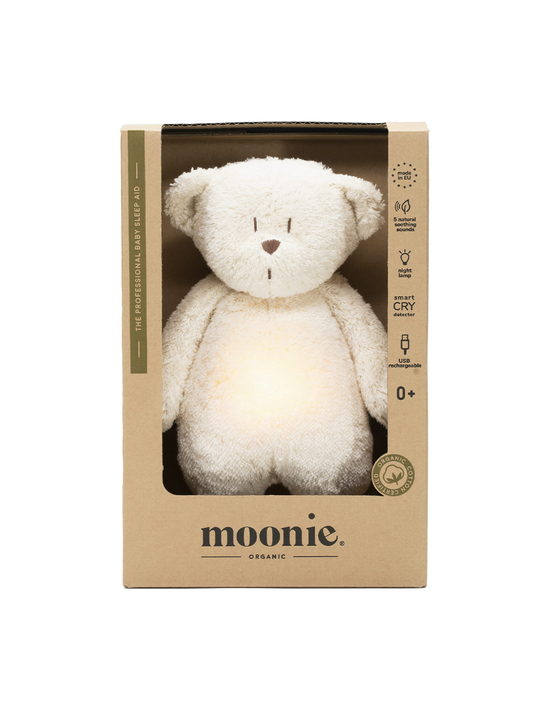 humming organic teddy bear with a bedside lamp