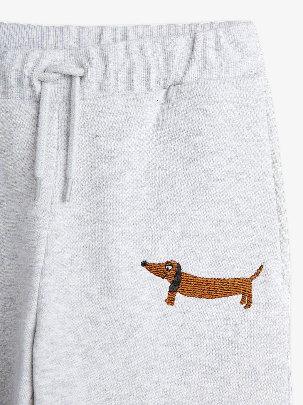 Pantalones deportivos con perro bordado