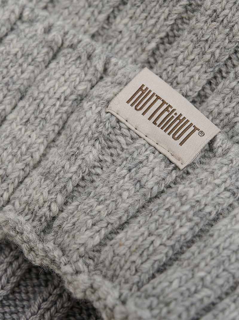 Cappello lavorato a maglia con pompon in alpaca