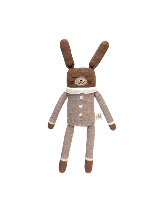 a large cuddly toy made of alpaca bunny oat jumpsuit