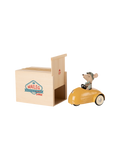mouse in a retro car with a wooden garage