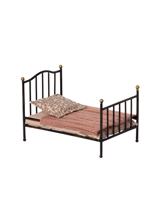 metal vintage crib with bedding