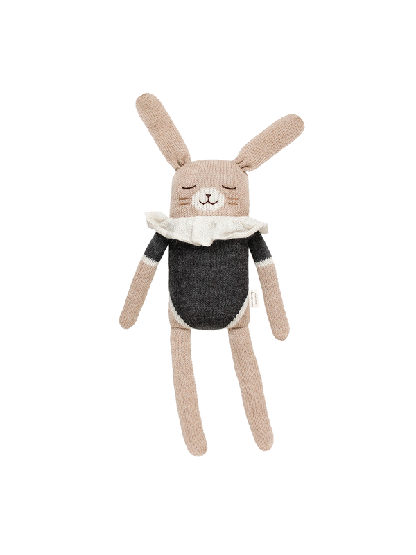 a large cuddly toy made of alpaca bunny black